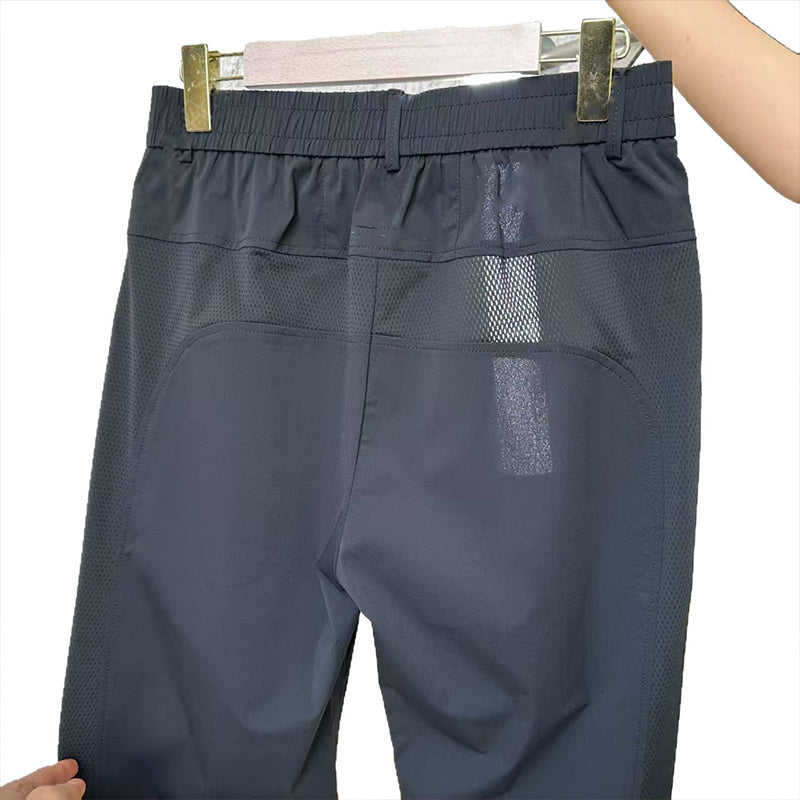 Set bestaande uit een ultradun, ademend sport-T-shirt van mesh en een lange broek